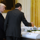 AT&T Senior Executive Randall Stephenson (R) explains to President Donald Trump how the 5G will be deployed in cities during the American Leadership in Emerging Technology Event at the White House, on June 22, 2017.